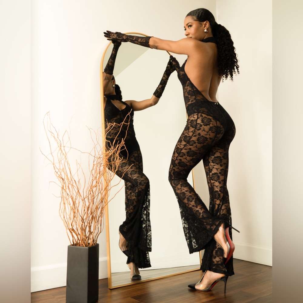 Black lace jumpsuit. New. Tags still on.